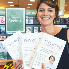 Dr. Myers posing with books