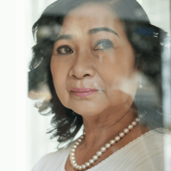 woman looking through window