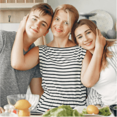 Woman hugging son and daughter